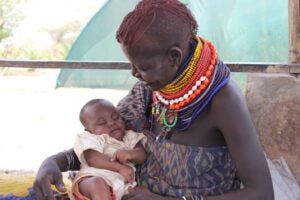 Mother with infant in drought-prone Turkana, Kenya